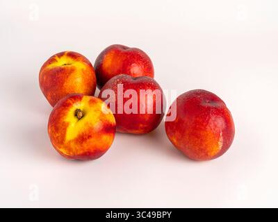 Fresh ripe nectarines on white background, grouped Stock Photo