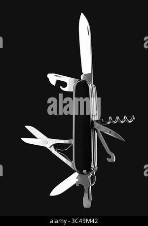 Multifunction army pocket folding knife isolated on black background Stock Photo