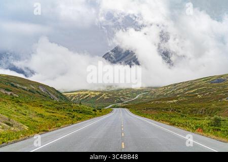 Highway to Cloud Mountain: Clouds shroud Mt. Seltat along the Haines Highway, creating a scenic, if somewhat obscured, view for travelers. Stock Photo