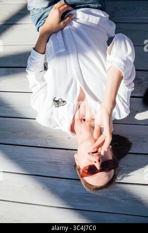Portrait of a 40-year-old woman in a white shirt Stock Photo