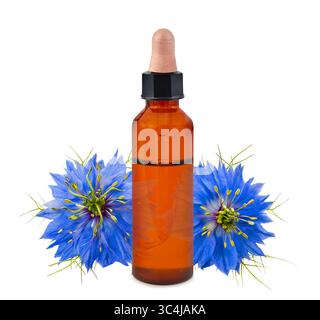 Nigella flowers with  essence bottle  isolated on white background Stock Photo
