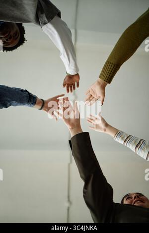 Diverse Teenagers Reaching out Hands Together during Counseling Session Stock Photo