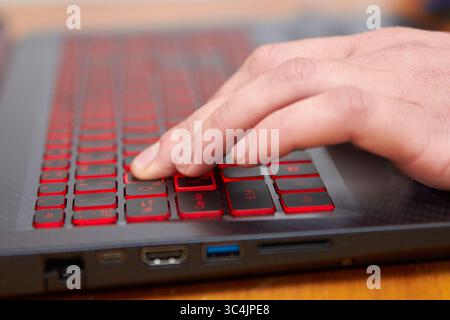 working man on laptop computer at home, new professions online on laptop computer Stock Photo