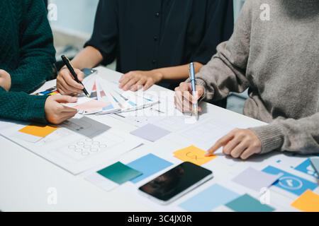 UX graphic designer planning application process development prototype wireframe for web smart phone. Creative digital development agency. Stock Photo