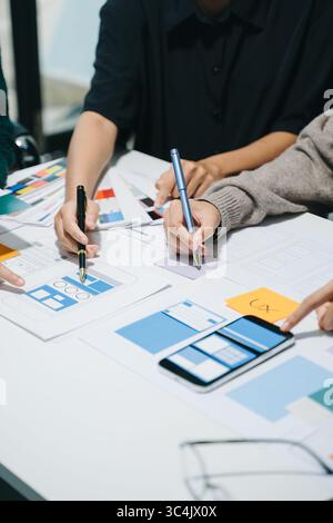UX graphic designer planning application process development prototype wireframe for web smart phone. Creative digital development agency. Stock Photo