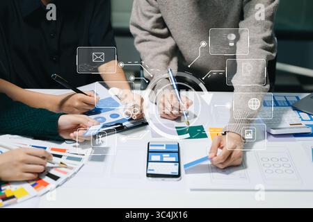 Asian businessman and woman people meeting in office. Employee brainstorm and work as team, plan and discuss project by point on paper and tablet. Stock Photo