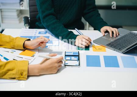 UX graphic designer planning application process development prototype wireframe for web smart phone. Creative digital development agency. Stock Photo