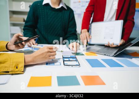 UX graphic designer planning application process development prototype wireframe for web smart phone. Creative digital development agency. Stock Photo