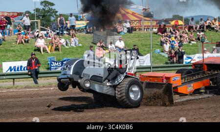 Tractor Pulling, a motorsport using superpowered tractors and trucks at Great Ecclestocn Show, Lancashire, UK. Stock Photo