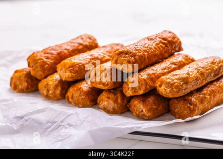 Raw south european skinless sausages cevapcici made of ground meat and spices, ready for a grill Stock Photo