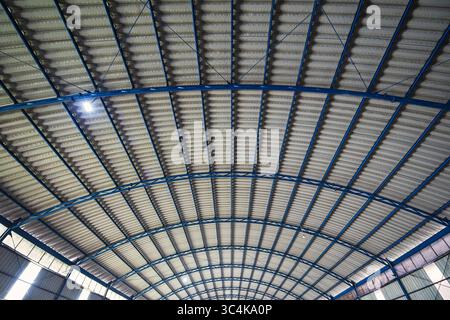 Interior view of the ceiling of a large metal structure in the warehouse building Stock Photo