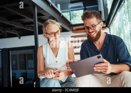 Engaging in Collaborative Work within a Modern Workspace that Utilizes CuttingEdge Technology Stock Photo