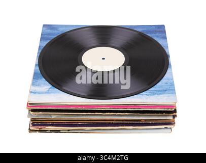 Vinyl record on a stack paper envelopes. Analog sound. Classic audio. Isolated on white background Stock Photo
