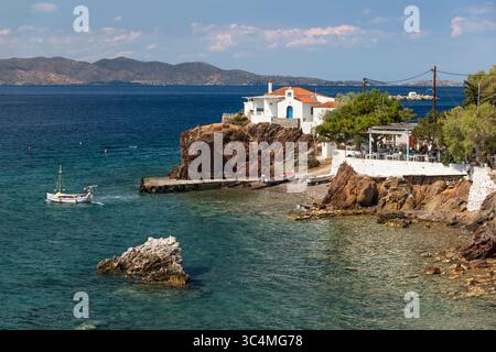 Taverna Marina restaurant and Greek Orthodox chapel at Vlychos, Hydra, Saronic Islands, Greek Islands, Greece, Europe Stock Photo