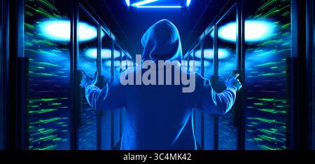 Hooded man standing with arms raised in server corridor Stock Photo