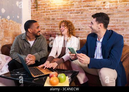 Multi ethnic team working together on project in modern office space Stock Photo