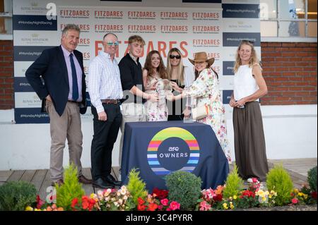 Windsor, Berkshire, UK. 28th July, 2025. The Winners Presentation after horse DRAGONFLY IN AMBER ridden by jockey Rossa Ryan wins Race Five, The Thames Alfa Romeo Slough Handicap Stakes, Class 6 at the Country & Western Racenight at Royal Windsor Racecourse in Windsor, Berkshire. Owner Mrs Wendy Edwards, Trainer Dominic Ffrench Davis, Lambourn, Breeder Mr B O'Neill, Sponsor High View Racing Ltd. Credit: Maureen McLean/Ģ����ý Live News Stock Photo