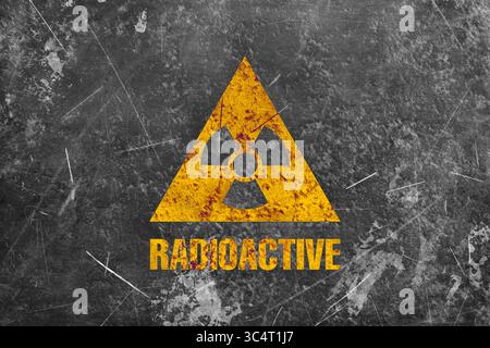 Radioactive sign on grey textured surface. Radiological pollution Stock Photo