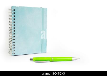 Bright blue hard cover notebook binded with a metal spring spiral isolated on white Stock Photo