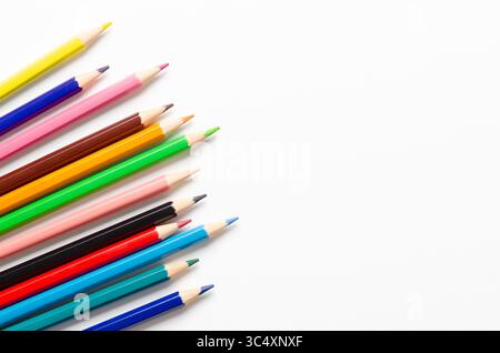 Collection of colorful sharpened pencils on a white background with copy space. Stock Photo