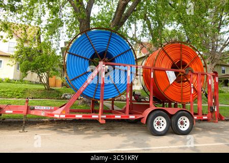 Large blue and red reels of conduit for holding electrical wire and transmitting data. St Paul Minnesota MN USA Stock Photo