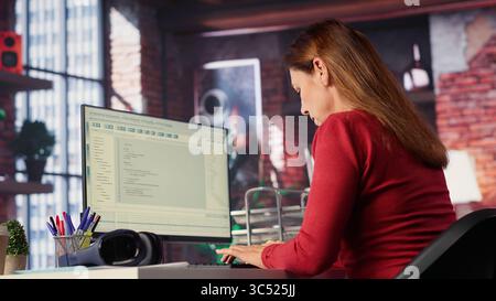 AI chatbot application displayed on a desktop computer for solutions, helping streamline text based tasks. Woman showcases innovation, automation and machine learning for seamless support. Camera A. Stock Photo