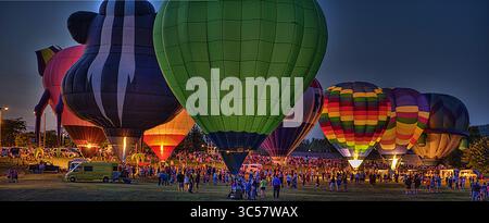 August 30, 2012 - Dansville, New  York, USA - Labor Day weeked balloon glow. The Glow" kicks off the Labor Day festivities in Dansville, New York. Several Hot air balloonist come from all parts of the United States to participate in this yearly event. At dusk the pilots inflate and light up they're teathered balloons as (Credit Image: © Joe Granita/ZUMA Wire/ZUMAPRESS.com) Stock Photo