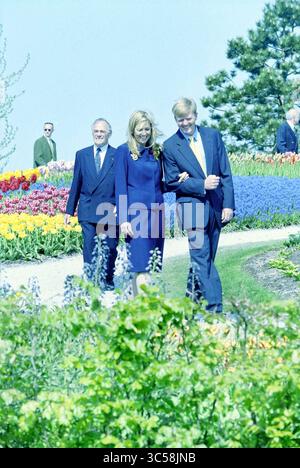 Maxima Keukenhof, Lisse, 08-05-2001 Whizgle News, Dutch Desk, The Netherlands, 1950-2000 A group of three individuals strolls through a vibrant garden filled with colorful flowers, engaging in conversation and enjoying the picturesque surroundings. In the background, other visitors can be seen admiring the beautiful landscape. Stock Photo