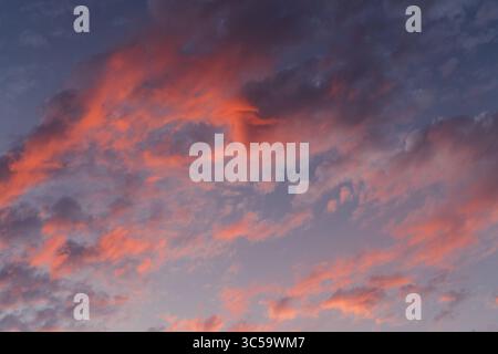 Fiery Cloud Formation in a Sunset Sky Stock Photo