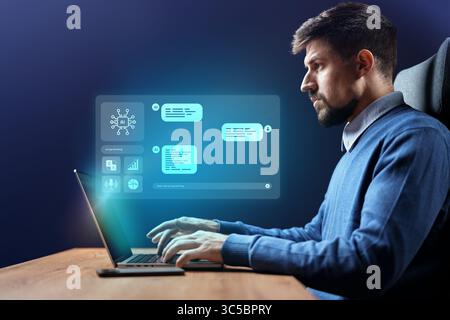 Man working on a laptop with data interface and graphs in a modern office environment at night Stock Photo