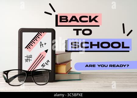 Back to school preparations highlight digital learning and essential supplies for students in a modern study setting Stock Photo