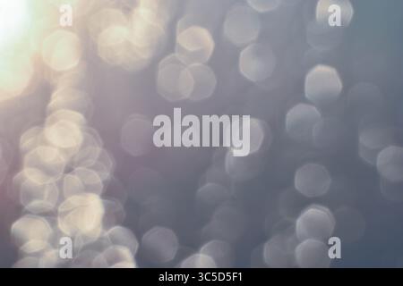 Golden light refracts through water, creating a mesmerizing abstract pattern. Lighting, Bokeh Stock Photo