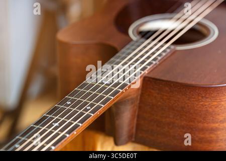 Classic brown wooden mahogany western guitar Stock Photo