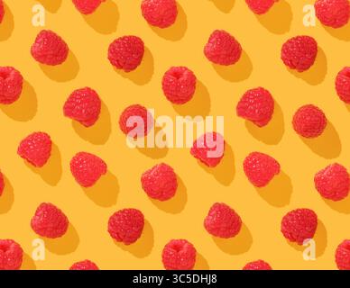 Pattern with raspberries on yellow background Stock Photo