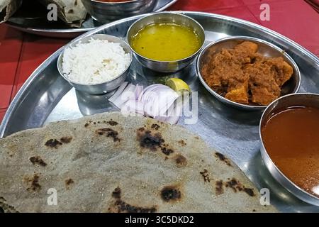 chicken tikka masala spicy curry meat food in a plate with rice and naan bread Stock Photo