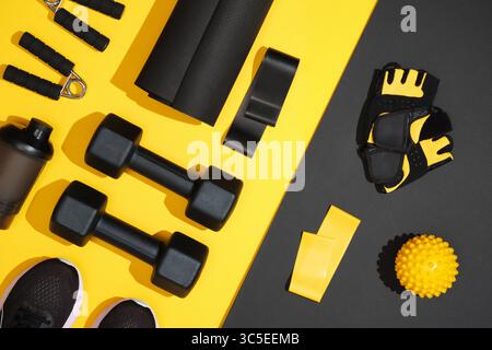 Black and yellow fitness set with sport items. Place for your text Stock Photo