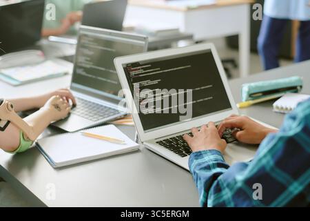 Kid Team Collaborating on Software Development Project Stock Photo