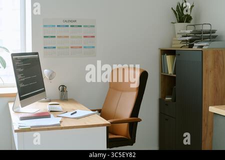 Modern Office Workspace Featuring Computer Monitor and Organized Desk Setup Stock Photo