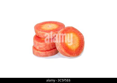 Whole carrots and round pieces isolated on white background. Whole and sliced carrot set isolated on white background. Stock Photo