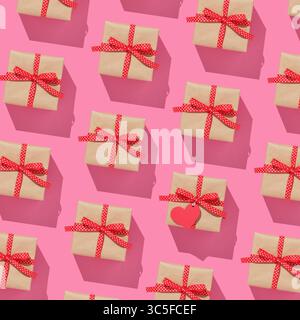 Pattern of brown gift boxes on with red bows on pink background Stock Photo