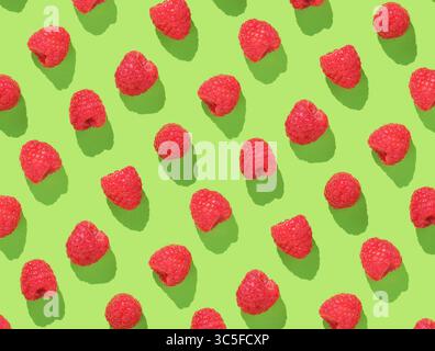 Pattern with raspberries on green background Stock Photo