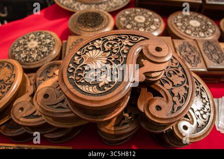 Jewelry box in the shape of a drop. Finely carved handwork on walnut wood. Stock Photo