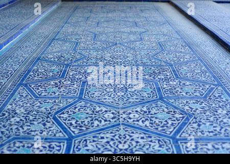 Floral tile motifs on the wall of a mosque in Khiva. Uzbekistan. Stock Photo