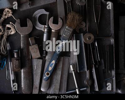 A collection of engineering tools on a bench in a workshop. Stock Photo