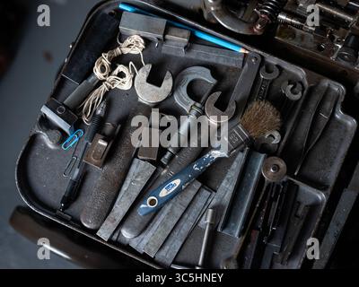 A collection of engineering tools on a bench in a workshop. Stock Photo