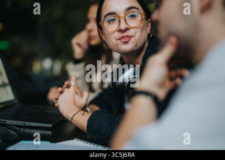 High school friends collaborating on assignments in a cozy coffee bar Stock Photo