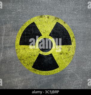 Radioactive sign on grey textured surface. Radiological pollution Stock Photo