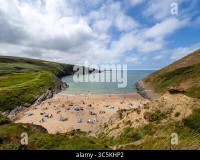 30th July 2025. Mwnt beach in Ceredigion, mid Wales is a wonderful spot for families to visit on holiday. On this beautiful sunny day the beach was busy with visitors. (c) Phil Jones/Alamy Live News Stock Photo