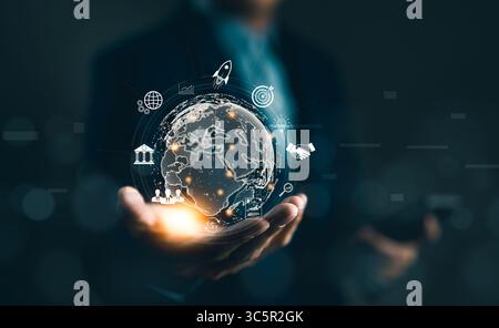 Businessman holding globe virtual on hand with business icons. Global internet connection application technology and digital marketing. Market link te Stock Photo