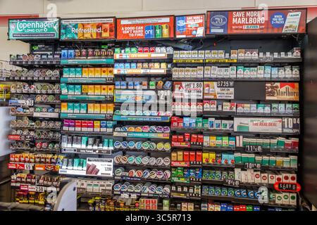 Miami Florida,7-Eleven convenience store,interior inside retail display  shelves,rows of cigarette packs,smokeless tobacco chew dip cans,nicotine  pouch Stock Photo - Alamy